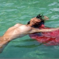 Nude swimming of a cute teenager girl