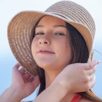 Nudist teenager Matty removes her swimsuit